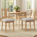 Set of two natural rubberwood dining chairs with beige upholstered seats
